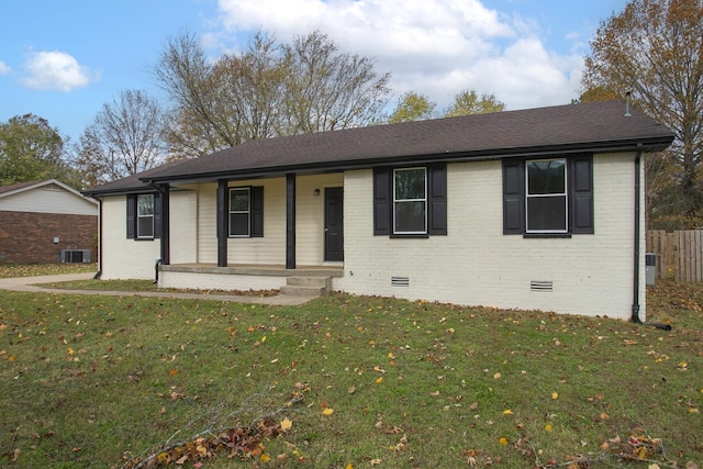 ranch-style house with covered porch and a front lawn