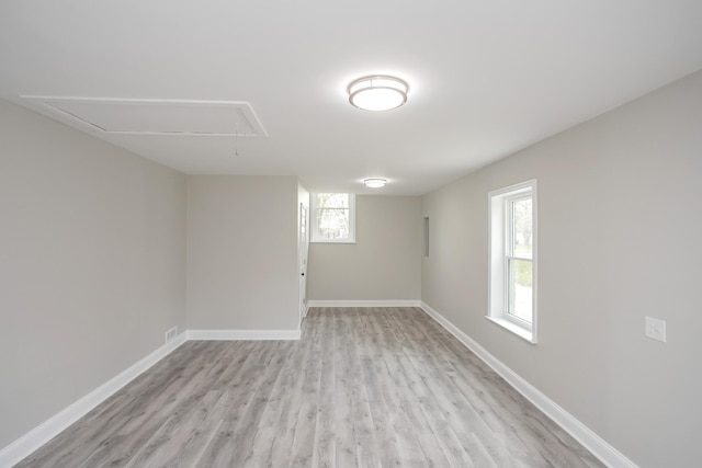 basement with light hardwood / wood-style floors