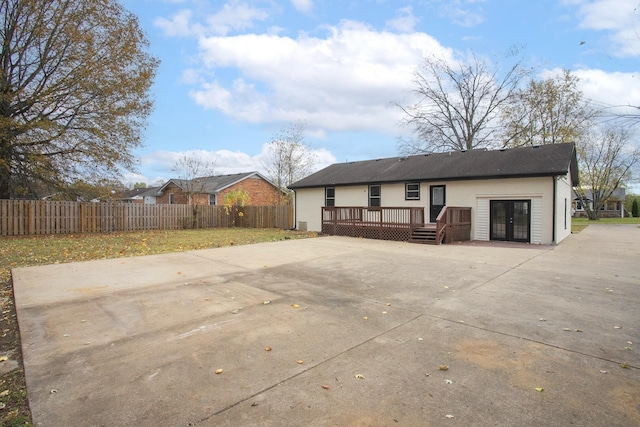 back of house featuring a deck