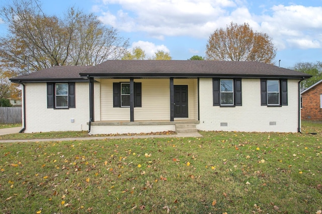 ranch-style home featuring a porch and a front lawn