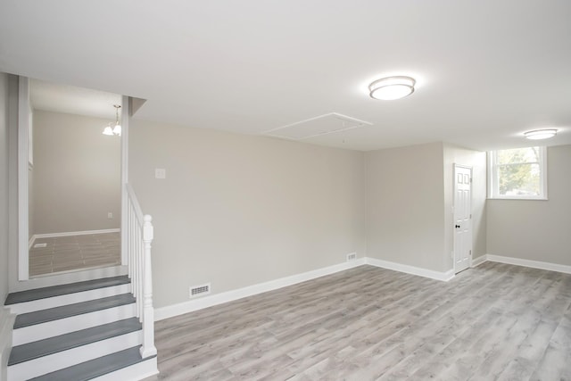 basement featuring light hardwood / wood-style floors