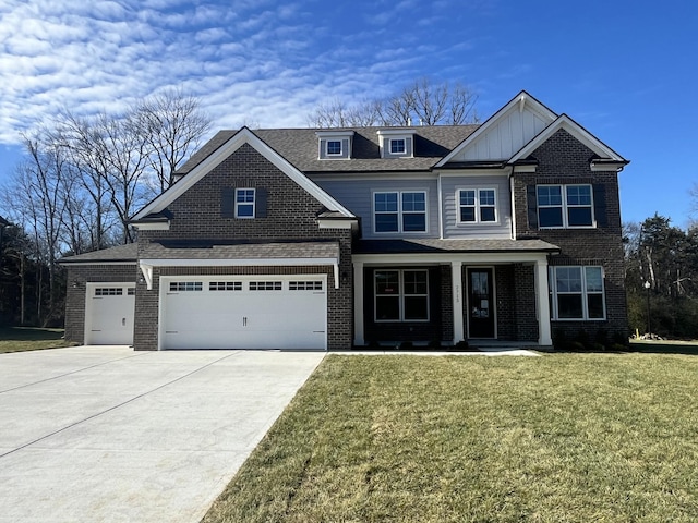 view of front of house featuring a front lawn and a garage