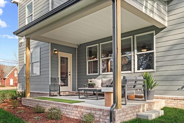 view of exterior entry with covered porch