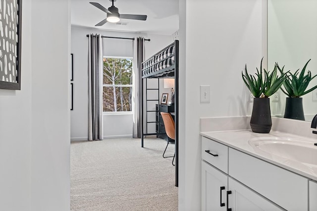 interior space with ceiling fan and vanity