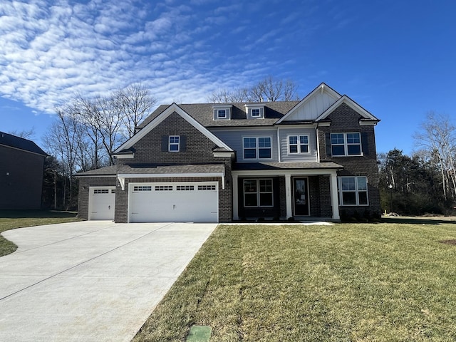 view of front of home featuring a front lawn and a garage