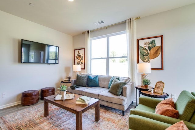 living room with light hardwood / wood-style flooring