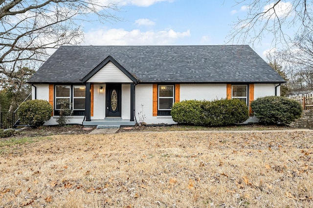 view of front of home with a front yard