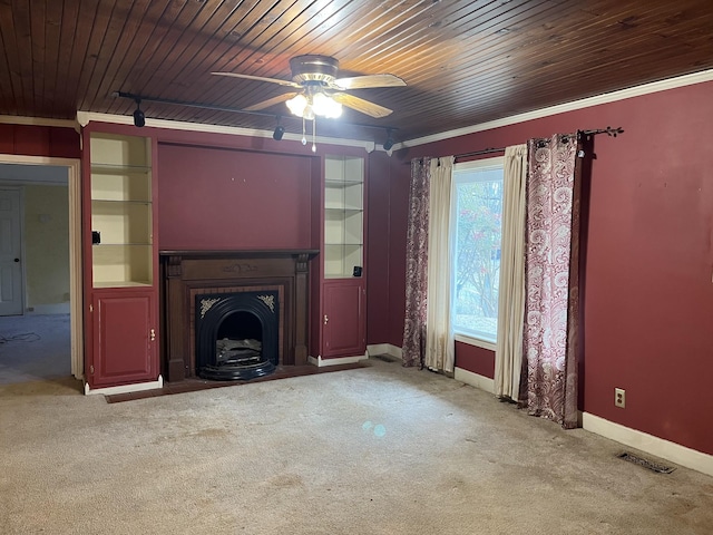 unfurnished living room featuring crown molding, ceiling fan, light carpet, and wooden ceiling