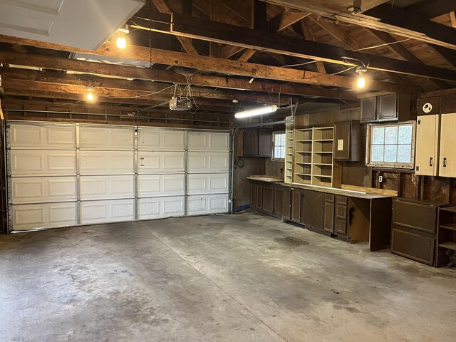 garage featuring a garage door opener and electric panel