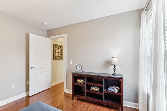 sitting room with hardwood / wood-style floors