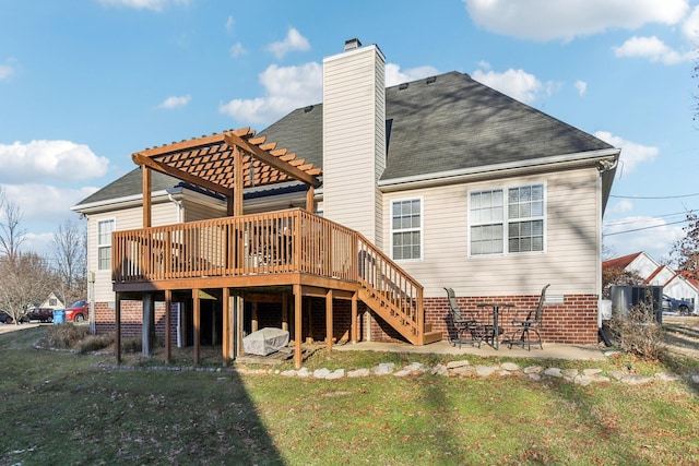 back of property with a patio, a deck, a yard, and a pergola