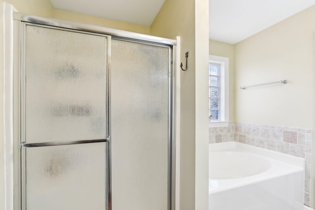 bathroom with separate shower and tub