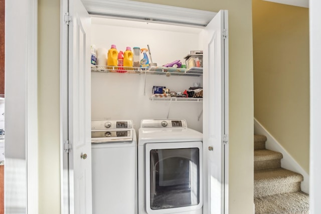 laundry room with washing machine and dryer