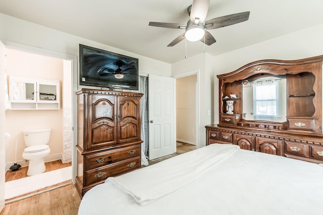 bedroom featuring ensuite bath, ceiling fan, and light hardwood / wood-style flooring