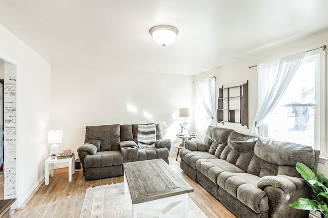 living room with light hardwood / wood-style flooring