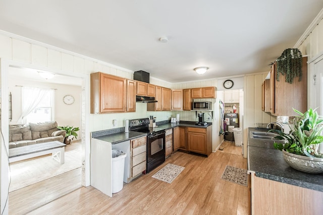 kitchen with sink, black range with electric cooktop, and light wood-type flooring