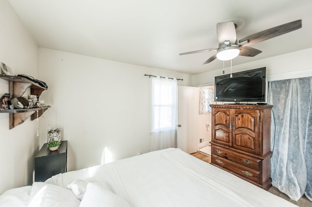 bedroom with ceiling fan and hardwood / wood-style flooring