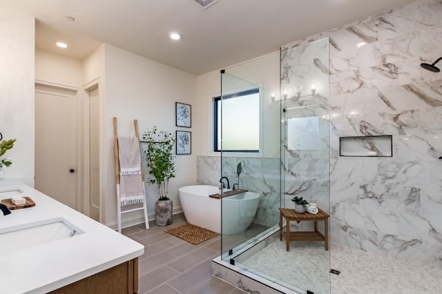 bathroom with independent shower and bath and vanity