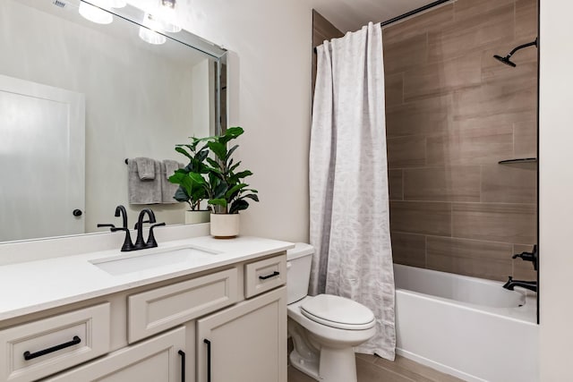 full bathroom featuring vanity, toilet, and shower / bath combo with shower curtain