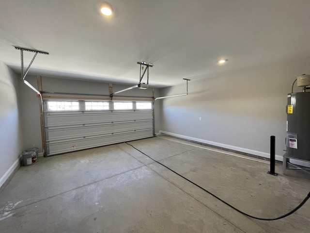 garage with water heater and a garage door opener