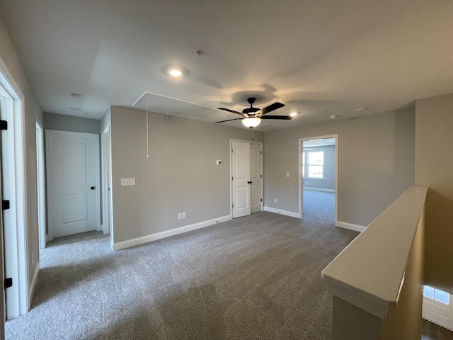 carpeted empty room with ceiling fan