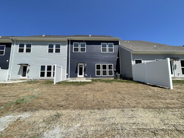 back of house featuring central AC