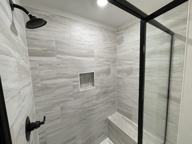 bathroom featuring tiled shower