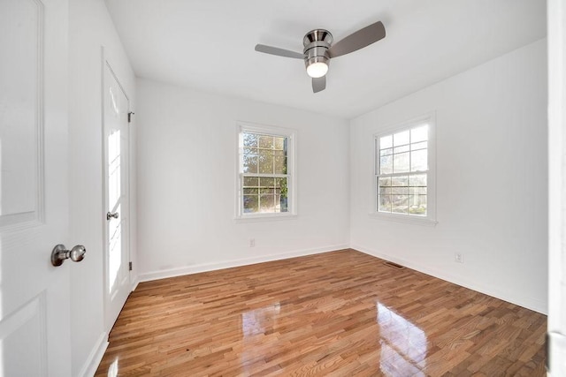 spare room with ceiling fan and light hardwood / wood-style floors