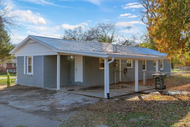 rear view of house with a carport