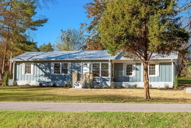 ranch-style house with a front lawn