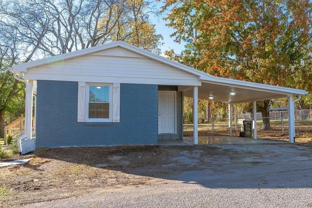 view of front of home featuring a carport