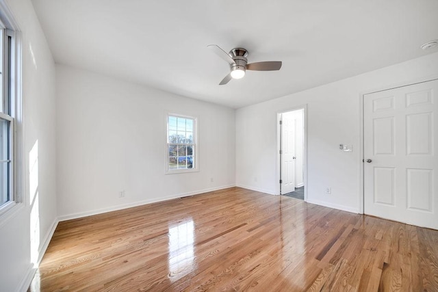 unfurnished room with ceiling fan and light hardwood / wood-style floors