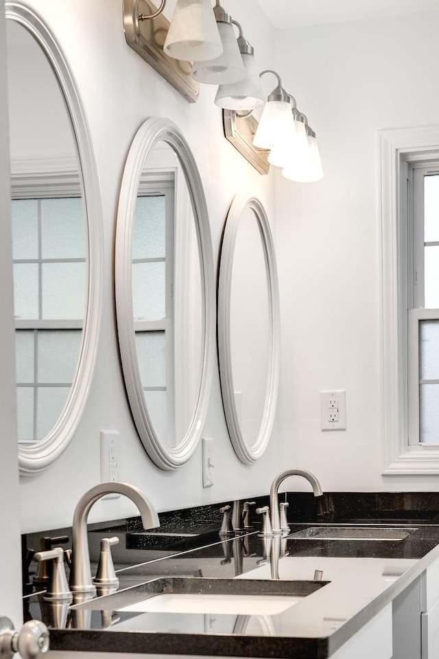 bathroom with vanity and plenty of natural light