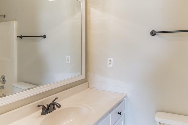 full bathroom featuring toilet, shower / washtub combination, and vanity