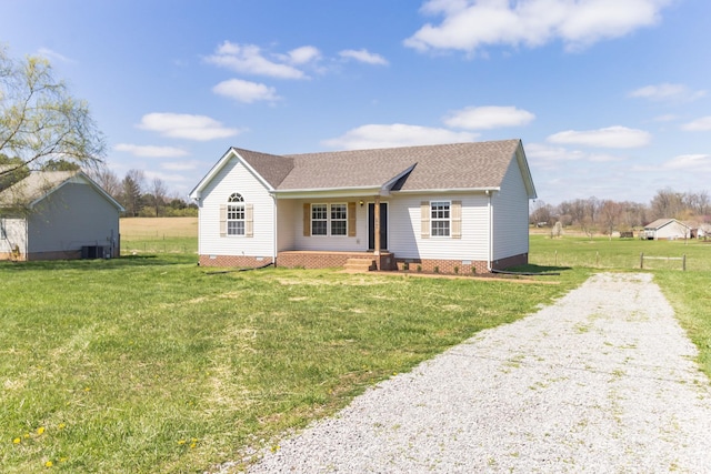 ranch-style house featuring a front yard