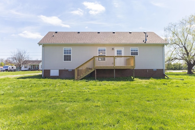 rear view of property featuring a yard and a deck