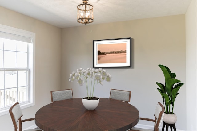 dining area featuring a notable chandelier