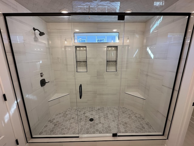 bathroom featuring an enclosed shower