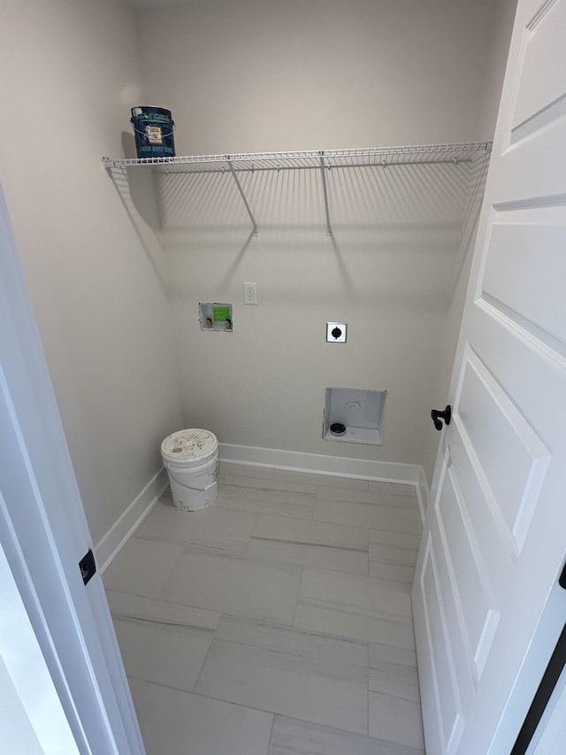 laundry room featuring electric dryer hookup and washer hookup