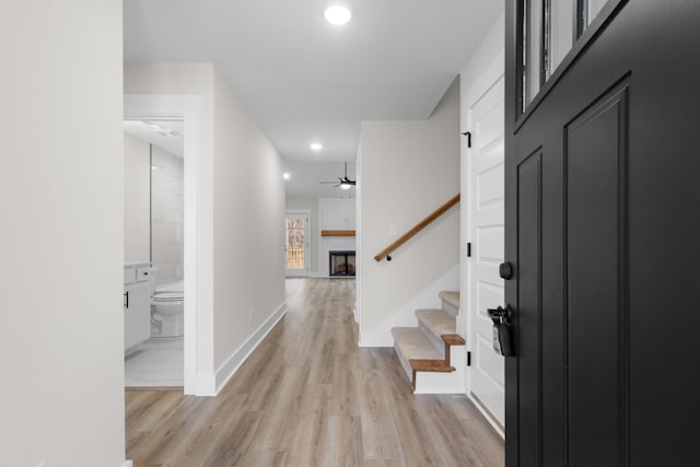 corridor with light wood-type flooring