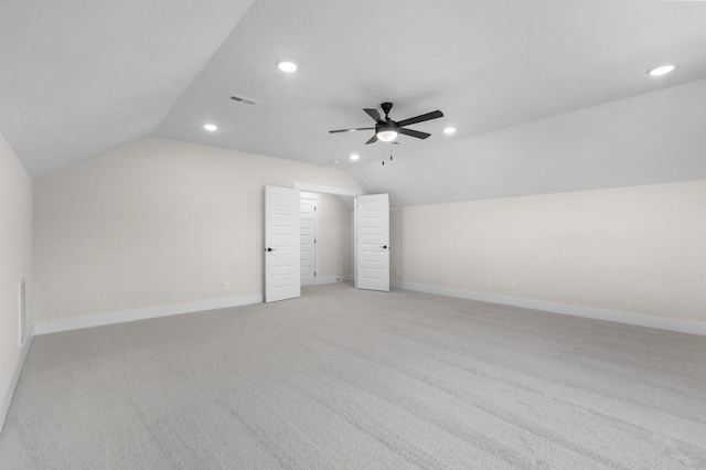 bonus room with lofted ceiling, ceiling fan, and light carpet