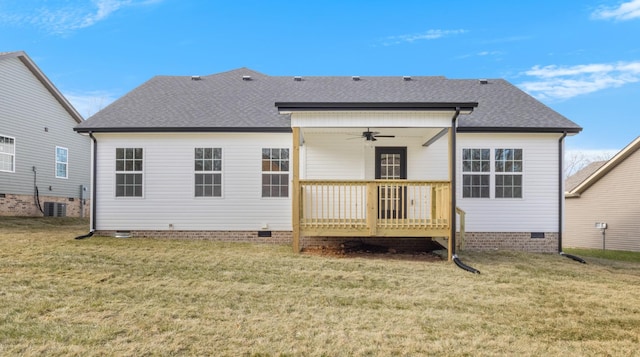 rear view of property featuring ceiling fan, a wooden deck, central air condition unit, and a yard