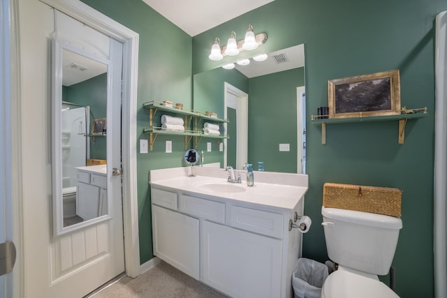 bathroom with toilet and vanity