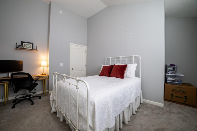 bedroom with carpet and lofted ceiling