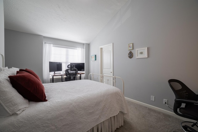 carpeted bedroom featuring a textured ceiling and lofted ceiling