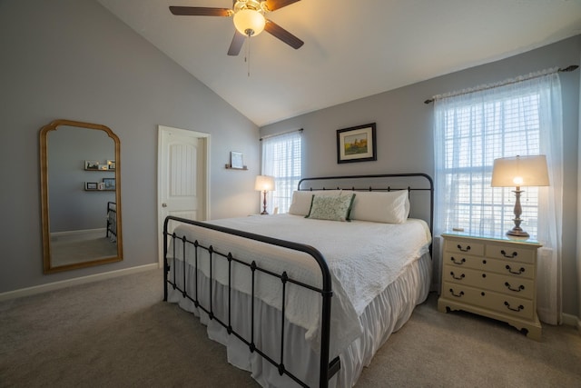 carpeted bedroom featuring ceiling fan and high vaulted ceiling