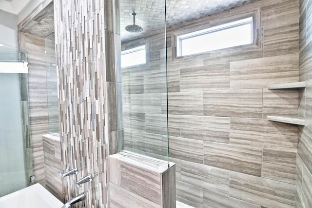 bathroom with a tile shower