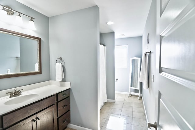 bathroom with vanity and tile patterned floors