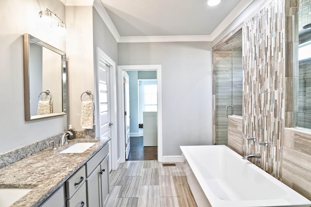 bathroom with crown molding, vanity, and shower with separate bathtub