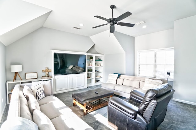 carpeted living room with ceiling fan and vaulted ceiling